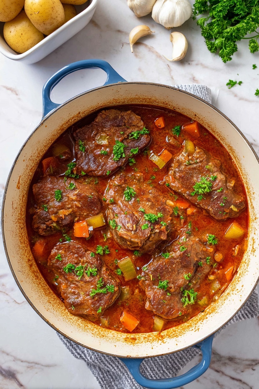A round white pot with blue handles holds five large pieces of brown meat layered in a thick reddish-brown sauce with small chunks of orange carrots and light green celery scattered over and around the meat. Bright green parsley leaves are placed on top of the meat pieces and sauce as garnish. The inside edge of the pot shows some light brown stains from cooking. The pot is on a white marbled surface with whole potatoes in a white container in the top left corner and whole garlic cloves and loose parsley leaves scattered near the top right corner. photo taken with an iphone --ar 2:3 --v 7